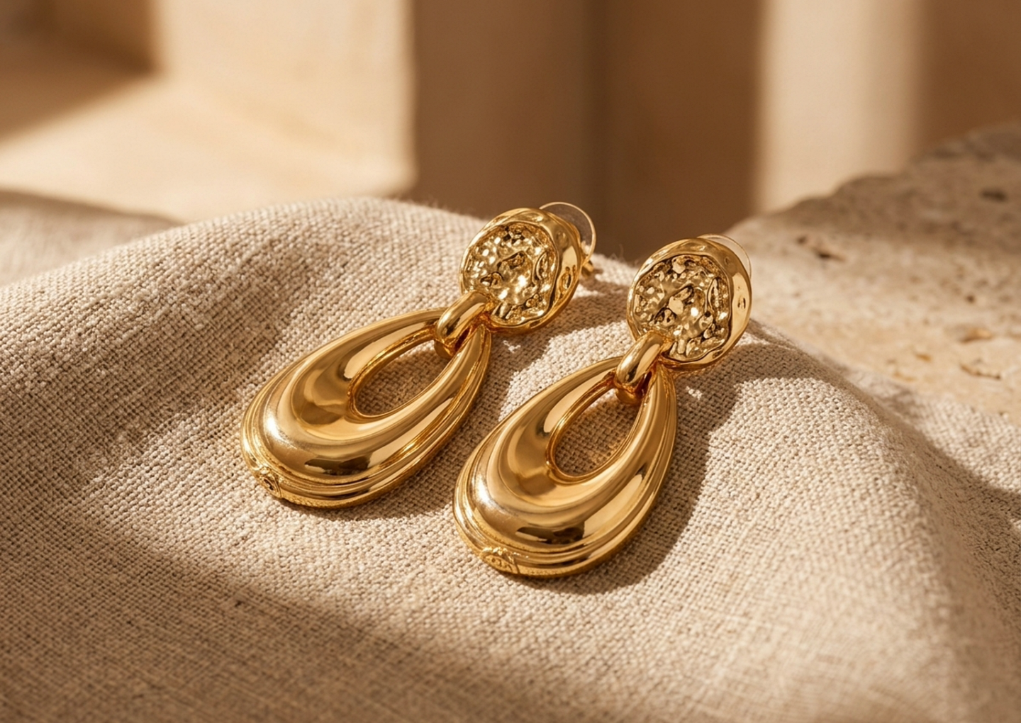Close editorial view of the Ayana Sculptural Gold Earrings
