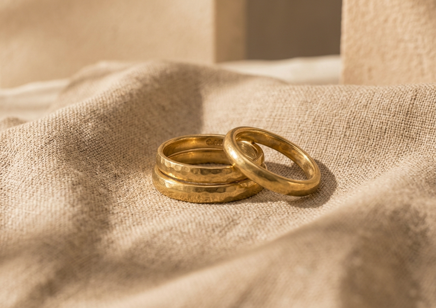 Close editorial view of the Oru Hammered Brass Ring Set